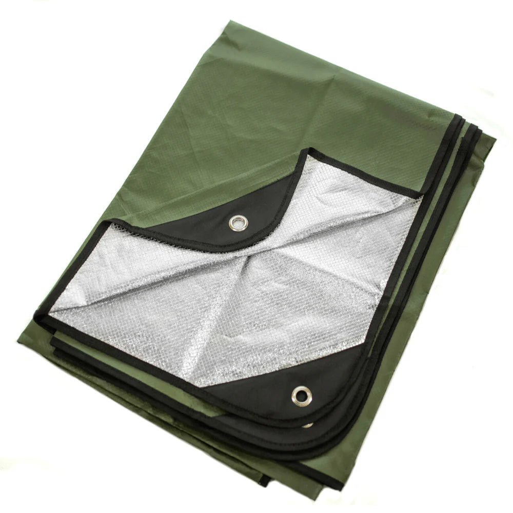 A green survival blanket with reverse reflective silver back and black reinforced tie-down grommets, displayed on a white background.
