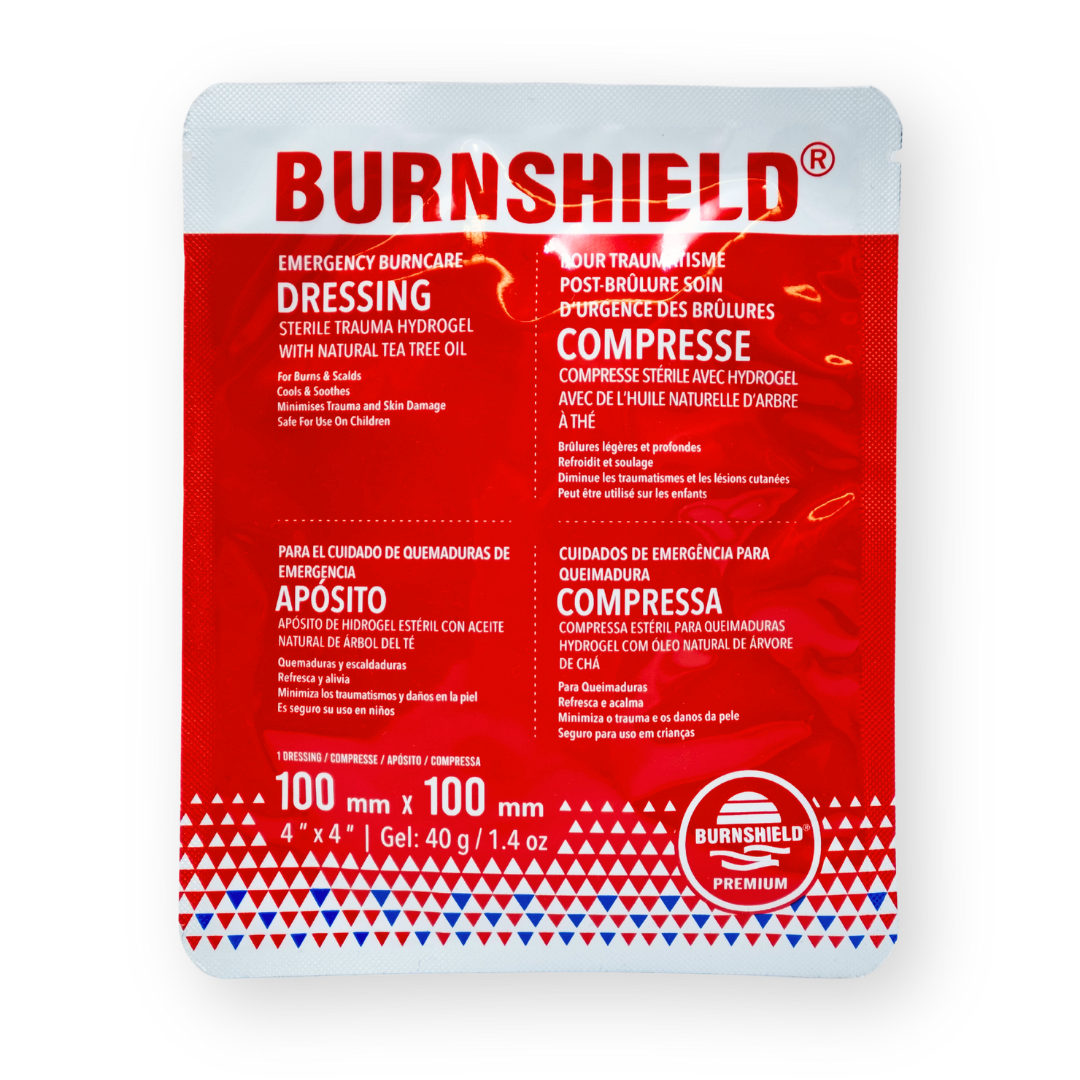 Packaging of Burnshield Dressing, showing a red and white label with product information, in a square shape.