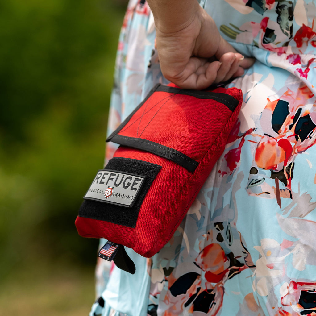 Refuge Medical Boo Boo First Aid Kit - Red, woman holding the Boo Boo kit