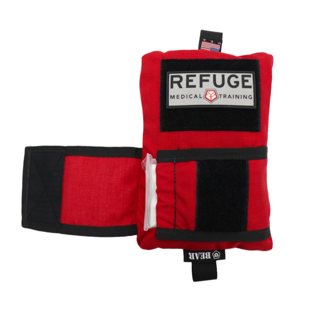 Refuge Medical Boo Boo First Aid Kit - Red, front pocket open to show ESMARK Bandage